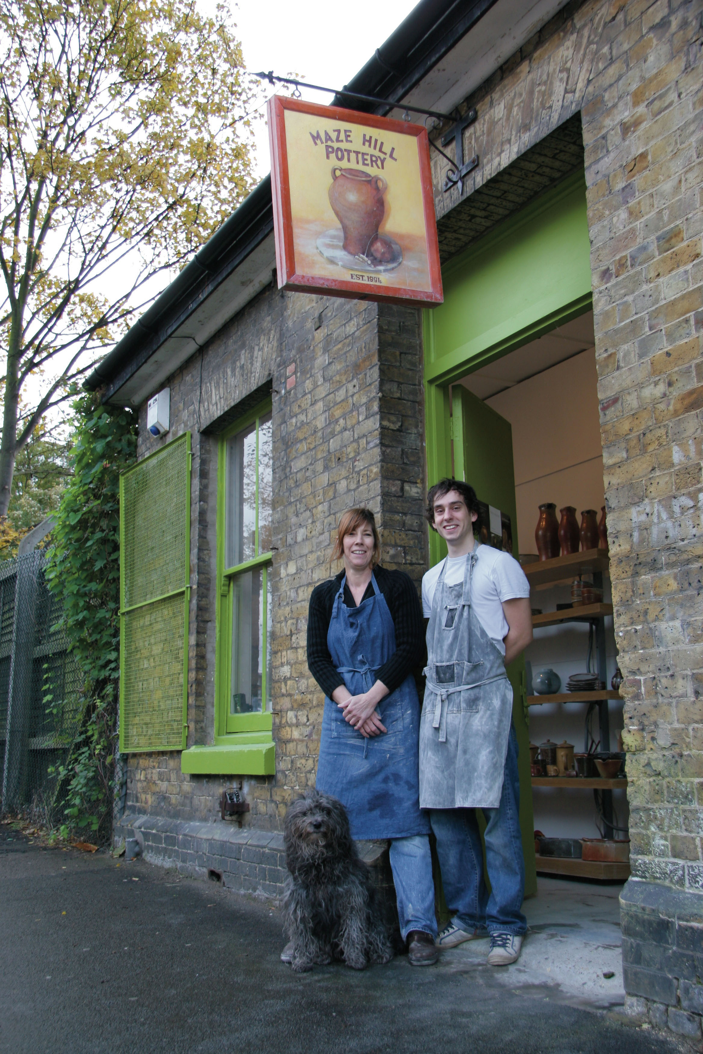 Hammond with apprentice Billy Lloyd and Lolly (the furry one) outside Mazehill Pottery, Greenwich, London.