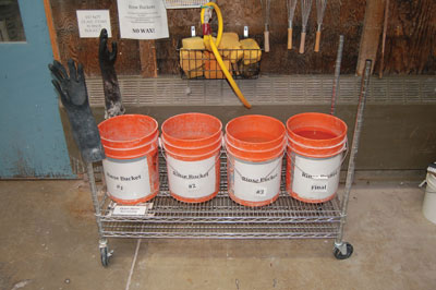 This four-bucket system at the University of Oregon is designed for capturing all glaze waste, which is then used, along with recycled clay, to make paver bricks.