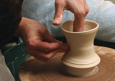 Fig.1 Compress and smooth the cylinder then make a spiral on the bottom half.