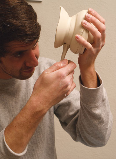 Fig.7 Attach one end of the handle to the top, pull and attach the other end.