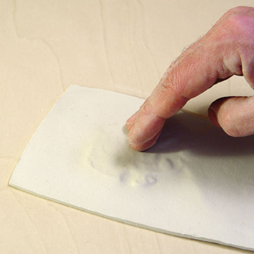 Fig.4 Impress the texture with gentle pats across the clay surface.