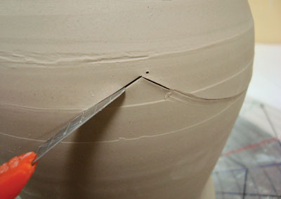 Fig.2 Connect the dots with curved cuts made using a box cutter.