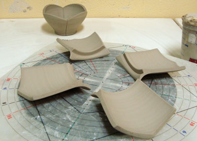 Fig.8 All four parts of the top, with rims facing the middle, are ready to be joined.