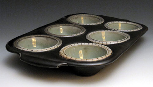 Muffin pan, all thrown and altered porcelain, with inlaid slip, then glazed and fired to cone 10 in reduction with soda, by Lorna Meaden, Durango, Colorado.