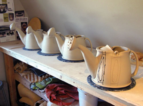 Watering cans in progress on the second floor of the studio, where forming and some decorating take place.