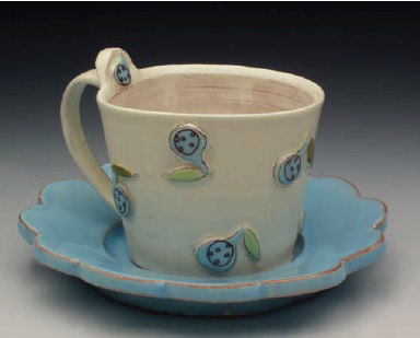 Finished teacup with appliqué design