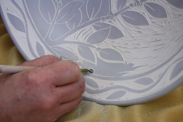 6 Carving the negative space areas with specific patterns and curving marks adds a sense of rhythm and movement.