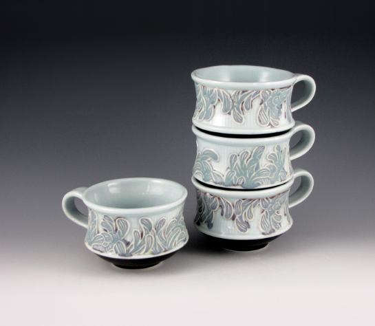 Stacking Chrysanthemum Tea Cups, each 5 in. (13 cm) in diameter, slip-cast porcelain with carved springs, fired to cone 10 in reduction.