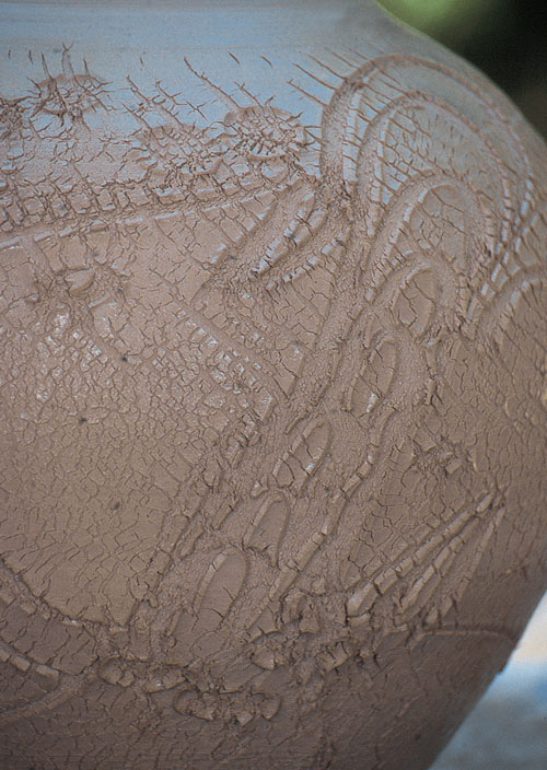 This detail shows the decorative cracking created from heating and expanding the sodium-silicate-coated clay.