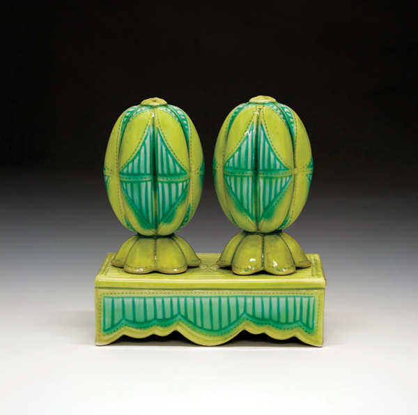 9 Andrea Denniston’s salt and pepper set, 5½ in. (14 cm) in height, cast and carved porcelain shakers, slab-built vase, electric fired to cone 9, 2014.