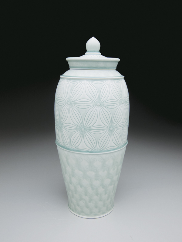 5 Covered jar, 18 in. (46 cm) in height, wheel-thrown porcelain, carved pattern, celadon glazes, fired in reduction to cone 10, 2014.