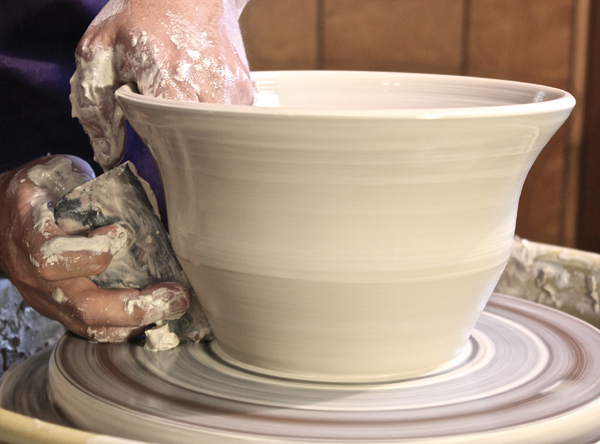 4. Use the rib to do one last pull to widen the form, starting at the bottom of the piece.
