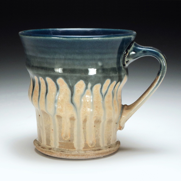 Wheel-thrown mug, ceramic, reduction fired.