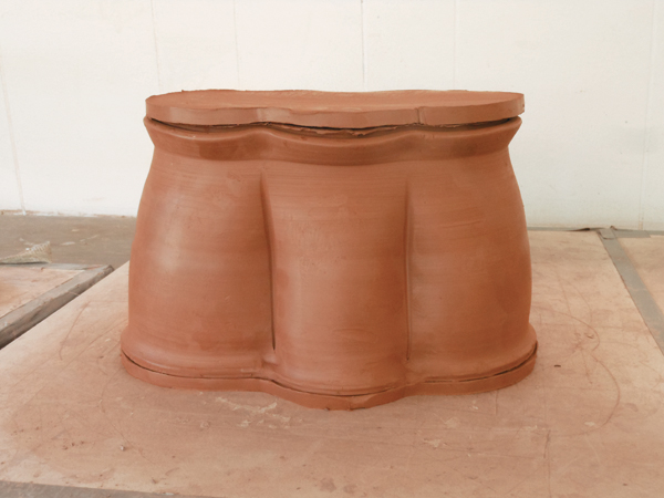 9 Cut a slab for the lid, score and add slip to both pieces, then attach it to the lid ring.