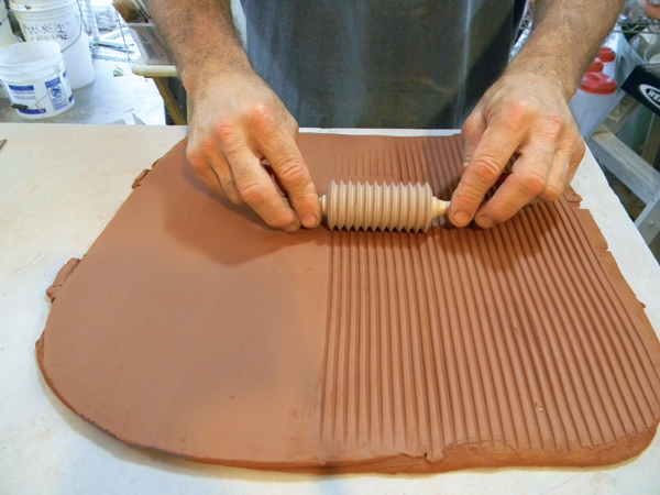 13. Roll out and compress a slab, then texture it with your desired pattern.
