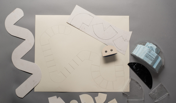 1 Paper stencils/templates, drawings, laser-cut Plexiglas, blue insulation foam, finished ceramic form showing embedded magnets for mounting; 2015–16.