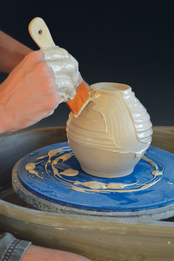 2 Use a chip brush and swipe up while turning the wheel counter clockwise. Each swipe will cause the slip to drip.