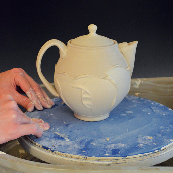5 Allow the pot to dry for about an hour, or until the thicker slip lines stiffen up, then flip it right-side up.