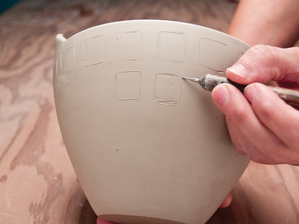 1 Sketch the size and spacing of the squares. Start below the rim, and decrease the size of lower rows to keep the columns even.