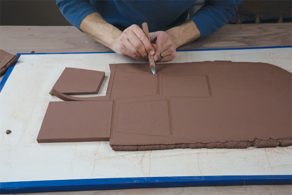 4 After the templates are marked on the slab, cut out the parts of the box.