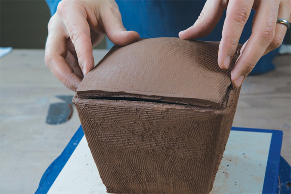 9 After the lid has slumped slightly in the box and firmed up enough to hold its shape, flip it over and attach it to the box form.