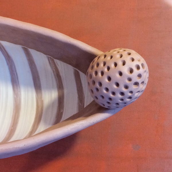12 Using a stiff, short bristle brush, wipe circles or lines through the wet, fluid slip.