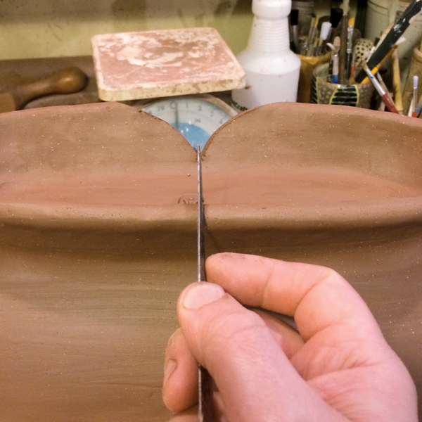 8 Cut a curved notch out of the foot.