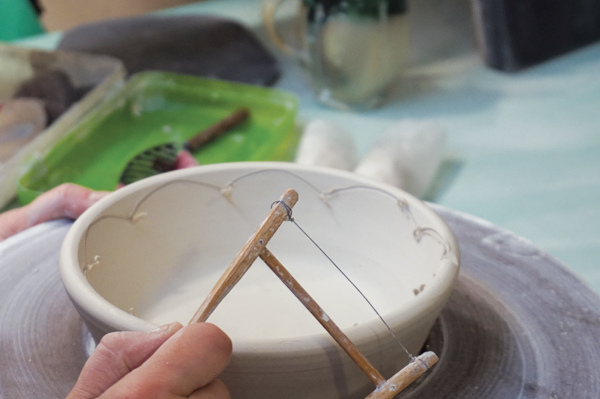 10 With a wire tool, cut out scallops along the edge of the plate.