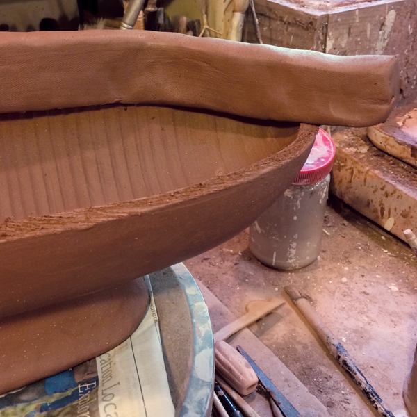 9 Lay out thick coils on the rim, slip and score both the rim and coils.