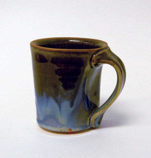 2 Ryan Coppage’s mug with Rutile Blue glaze (see recipe on p. 99) with Peach Black Tenmoku on the lip, fired to cone 10 in reduction.