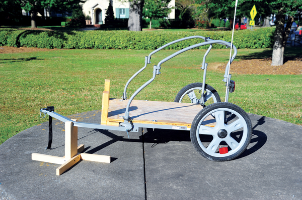 1 Brett Beasley’s converted bicycle trailer empty and ready to load up with supplies and stock to bring to the local farmer’s market sale.