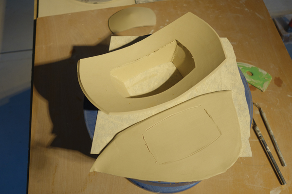 10 Trace the shape of the foot onto a slab, then cut out the shape and remove any excess clay. Score and attach the two pieces.