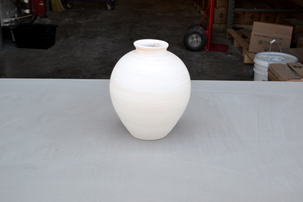 1 Throw or handbuild a piece that is either cylindrical or convex for the best placement and drip results.