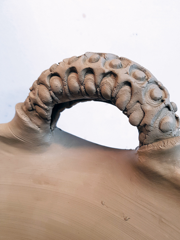 5 Score and slip the leather-hard handles to the altered rim before adding a slip to the plate.