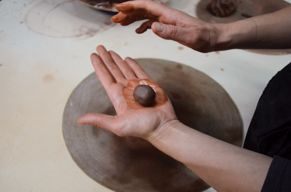7 Rehydrate a small amount of clay by wetting your palms and rolling the clay between your hands.
