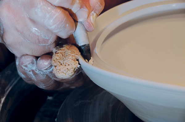 2 Place the tool in the center of the rim, then press into the rim while supporting the exterior with a sponge.