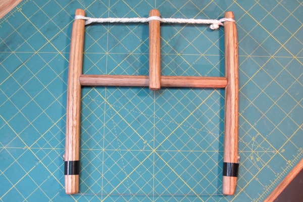 9 The finished product, with wire ends taped off and the tensioning dowel rotated, creating a multi-use tool that is ready for use.