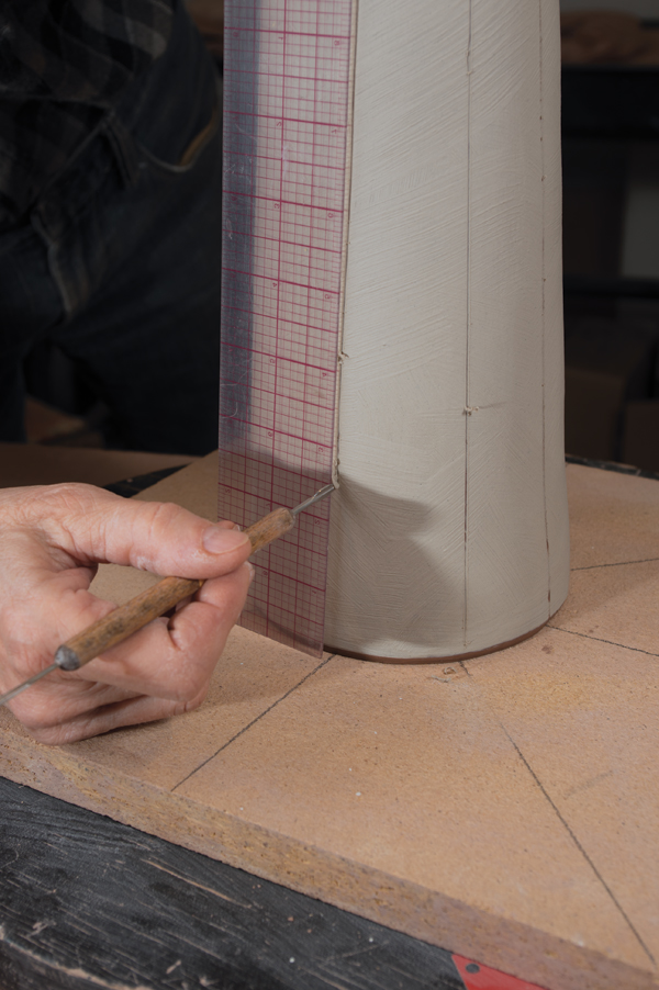 15 Apply white engobe to the exterior, then use a ruler to make evenly spaced vertical sgraffito lines.