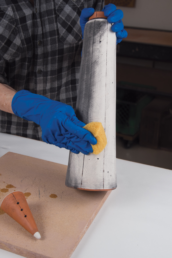 16 After the bisque firing, apply underglaze stain, then wipe off excess with a sponge.