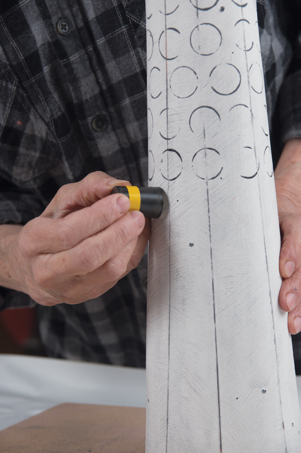 17 Use a plastic cap dipped in underglaze to create a pattern on the surface.