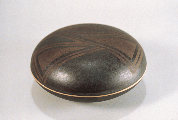 8 Judi Dyelle's black lidded box, porcelain, sandblasted, tape-resist design.