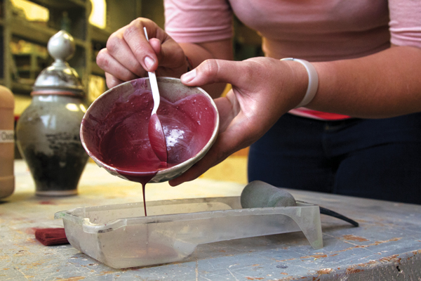 4 To allow ease of painting, the oxide mixture is transferred into the paint tray. Any leftover oxide may be reused, or allowed to dry and transferred back into the storage container.