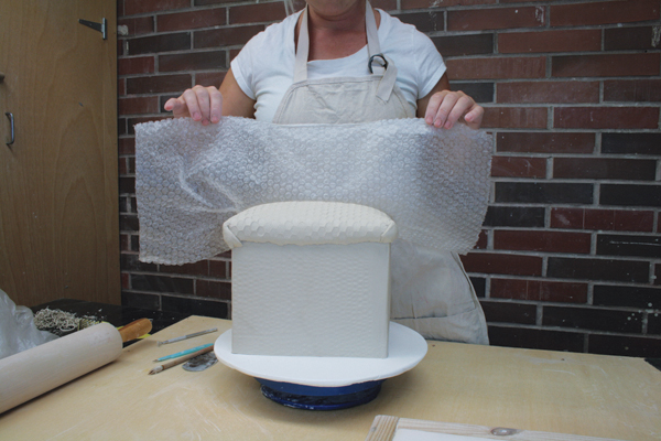 8 Flip the slab over, score and slip, and attach it to the top of the larger box.