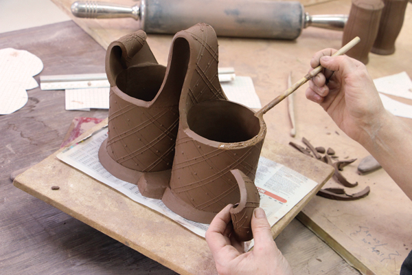 9 Make and attach handles. Go back and check all connections and clean up any rough edges on the base.