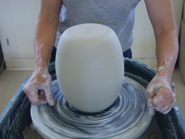 8 Trim and rib the form to round and smooth the top. Wire under the dish to remove it from the second bat.