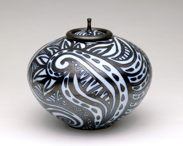 2 Mahmoud Baghaeian's lidded jar, bisque fired, glaze, liquid wax emulsion applied, washed with a wet sponge, and glazed again.
