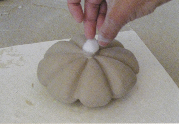 10 Dipped cotton is attached to the cast form.