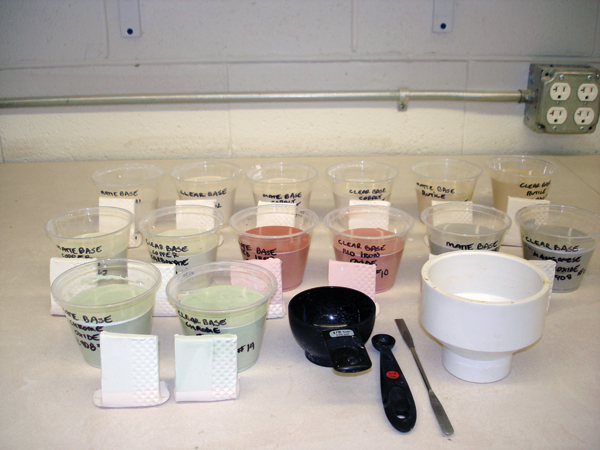 Mixed glaze tests from 2 base glazes, the measuring devices used and the glazed tiles, ready to be fired.