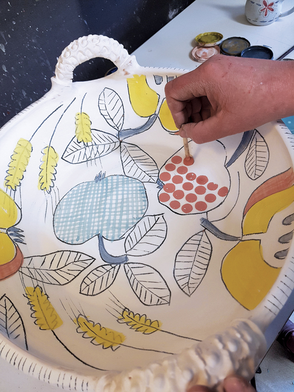2 Dots are added to fruit forms using a foam stamp. Try various-tipped tools to create unique patterns.