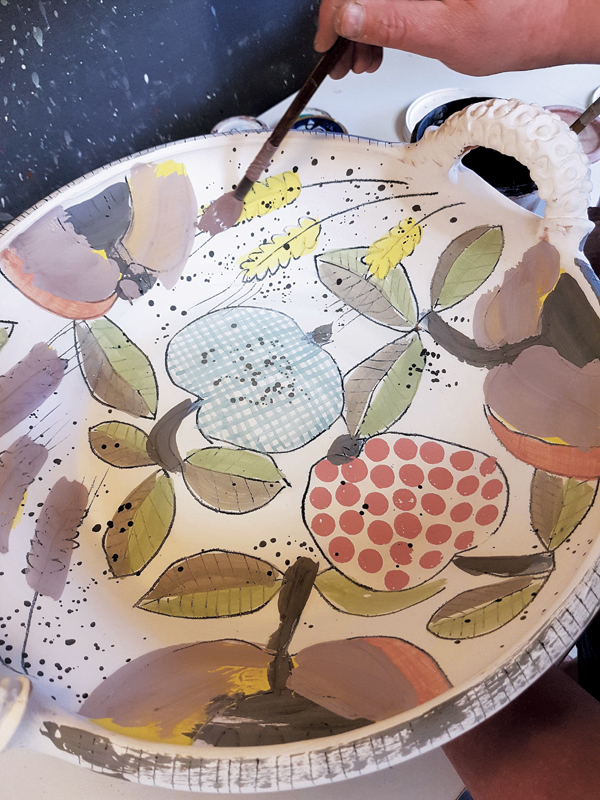 4 All of the yellow underglaze is covered with an iron-rich glaze to make it run and brighten the yellow.